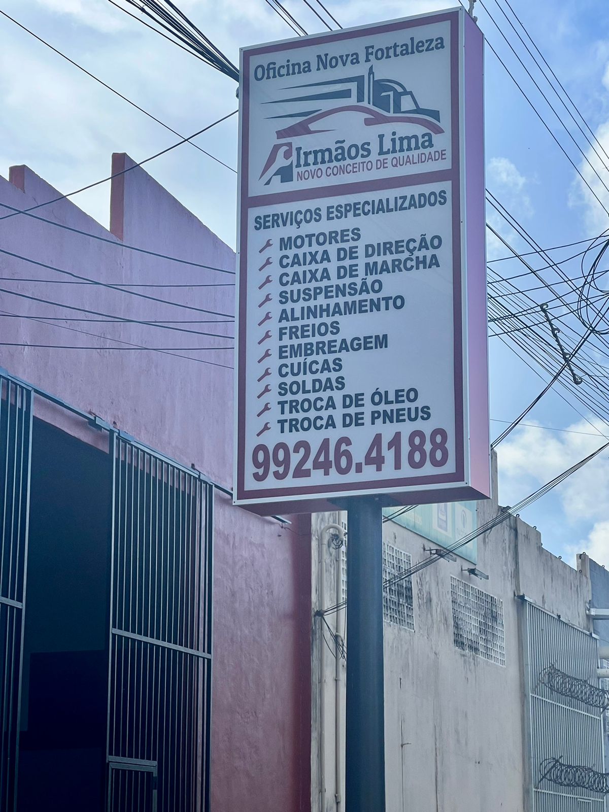 Placa de serviços Oficina Nova Fortaleza Irmãos Lima